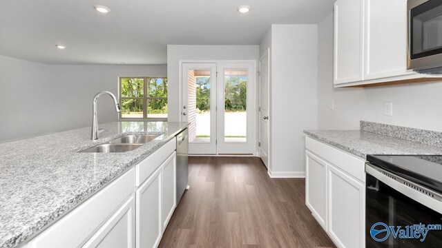 409 Jackson Point Cir, Huntsville, AL 35811 - kitchen featuring a sink, appliances with stainless steel finishes, dark wood-style flooring, white cabinetry, and recessed lighting