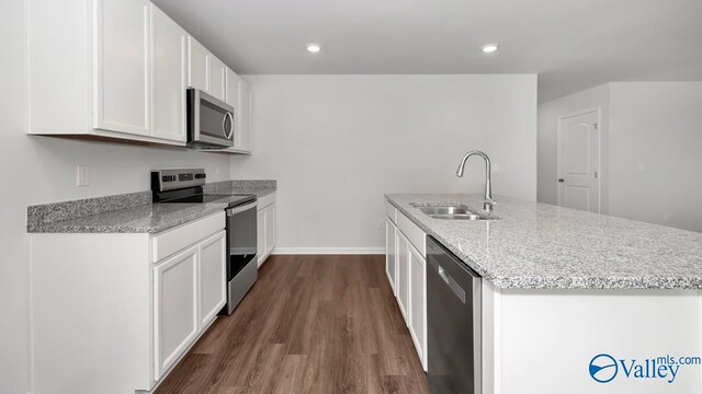 409 Jackson Point Cir, Huntsville, AL 35811 - kitchen featuring appliances with stainless steel finishes, a sink, dark wood-style flooring, white cabinets, and baseboards