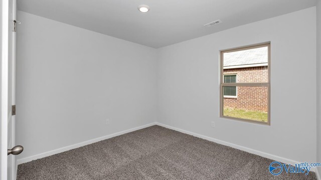 409 Jackson Point Cir, Huntsville, AL 35811 - carpeted spare room featuring baseboards