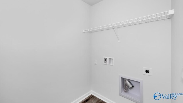 409 Jackson Point Cir, Huntsville, AL 35811 - washroom with hookup for a washing machine, hookup for an electric dryer, baseboards, and wood finished floors