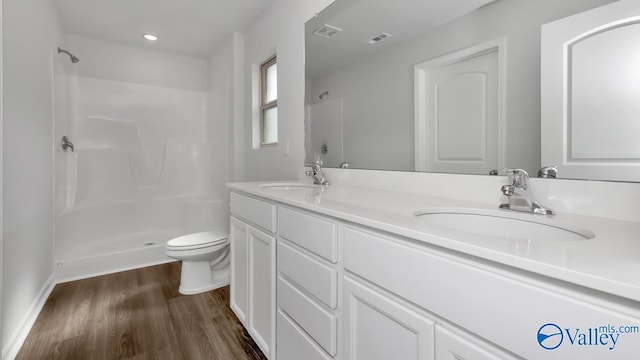 409 Jackson Point Cir, Huntsville, AL 35811 - full bath featuring toilet, wood finished floors, double vanity, a shower, and recessed lighting
