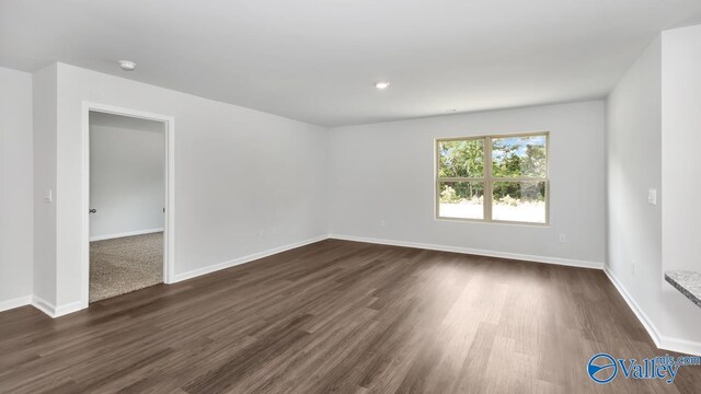 409 Jackson Point Cir, Huntsville, AL 35811 - unfurnished room featuring baseboards, dark wood-style floors, and a smoke detector