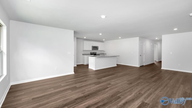 409 Jackson Point Cir, Huntsville, AL 35811 - unfurnished living room with recessed lighting, a sink, baseboards, and dark wood finished floors