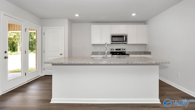 409 Jackson Point Cir, Huntsville, AL 35811 - kitchen featuring appliances with stainless steel finishes, a sink, white cabinets, light stone counters, and a kitchen island with sink