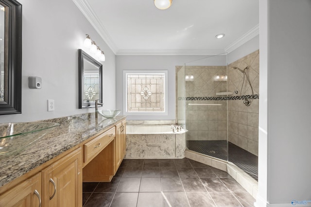 bathroom featuring tile patterned flooring, shower with separate bathtub, vanity, and ornamental molding