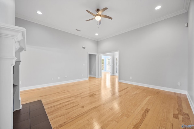 unfurnished living room featuring light hardwood / wood-style floors, ceiling fan, and crown molding