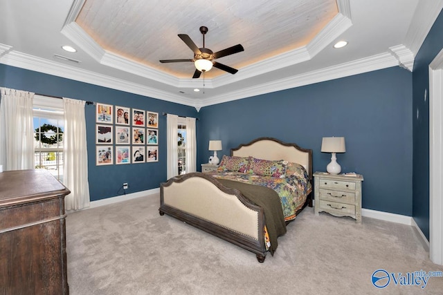 bedroom featuring light carpet, a raised ceiling, ceiling fan, and ornamental molding