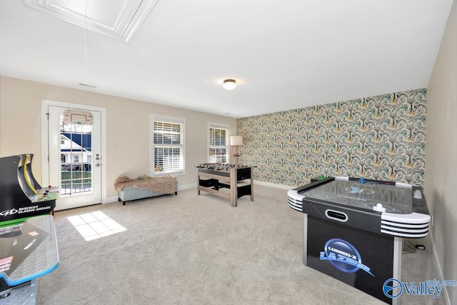 game room featuring light carpet