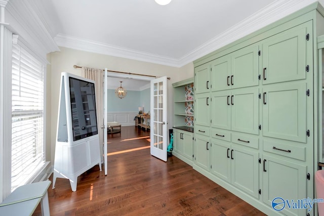 interior space with french doors, dark wood-type flooring, and ornamental molding