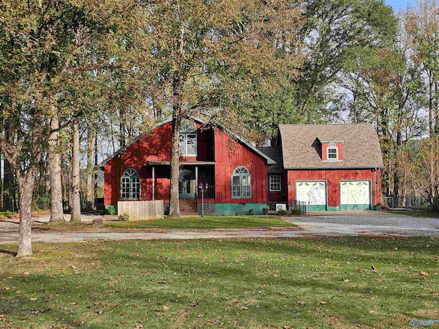 view of front of house with a garage and a front lawn