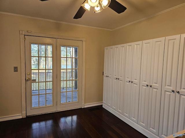 doorway to outside with crown molding, dark hardwood / wood-style flooring, and ceiling fan