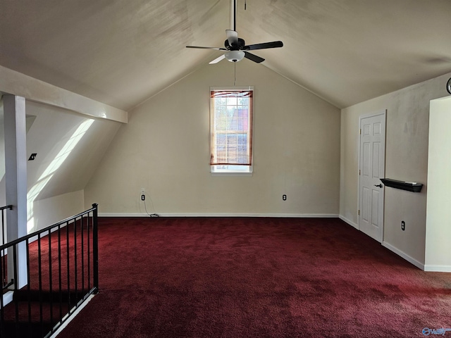 bonus room featuring dark colored carpet, ceiling fan, and vaulted ceiling