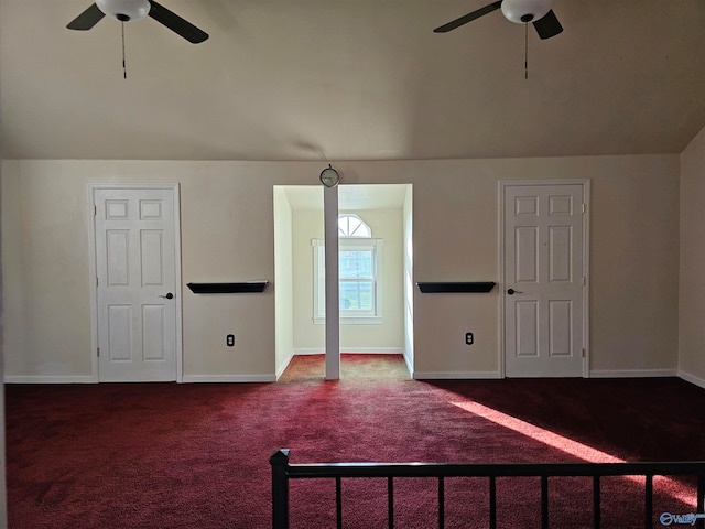 interior space featuring carpet flooring, ceiling fan, and vaulted ceiling