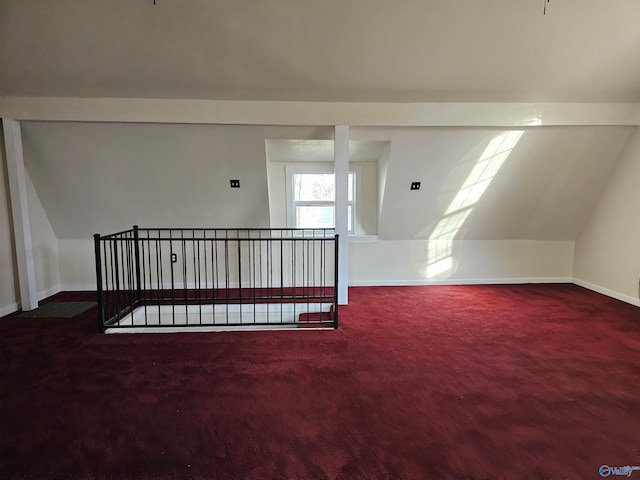 additional living space featuring carpet flooring