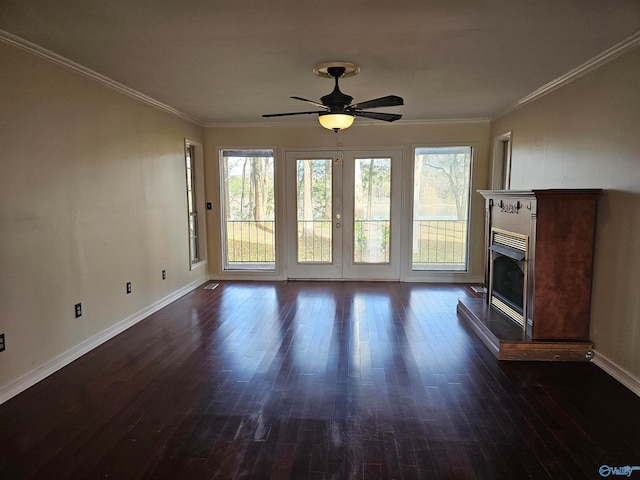 unfurnished living room with ceiling fan, crown molding, and dark wood-type flooring