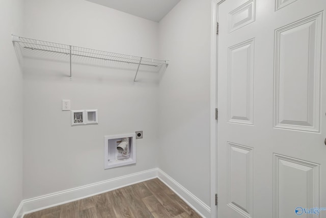 washroom with hookup for an electric dryer, hookup for a washing machine, and hardwood / wood-style flooring