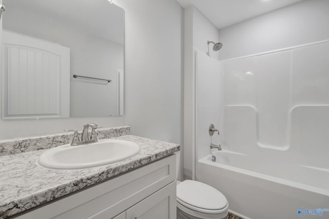 full bathroom featuring bathtub / shower combination, vanity, and toilet