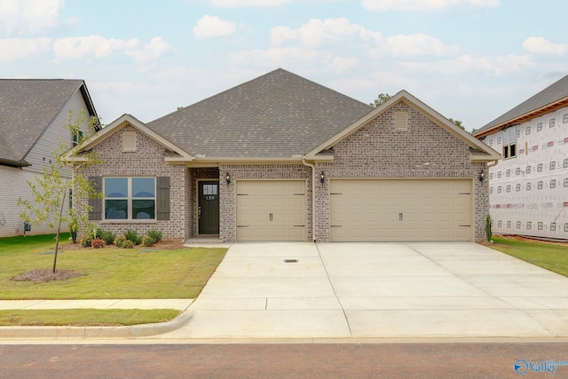 craftsman inspired home with a garage and a front yard