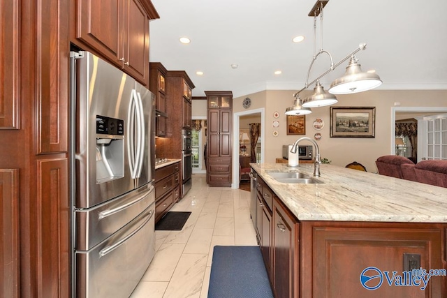 kitchen with sink, decorative light fixtures, a center island with sink, appliances with stainless steel finishes, and crown molding