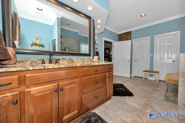 bathroom featuring vanity and crown molding