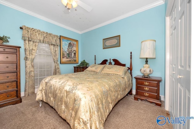 carpeted bedroom featuring crown molding, ceiling fan, and a closet