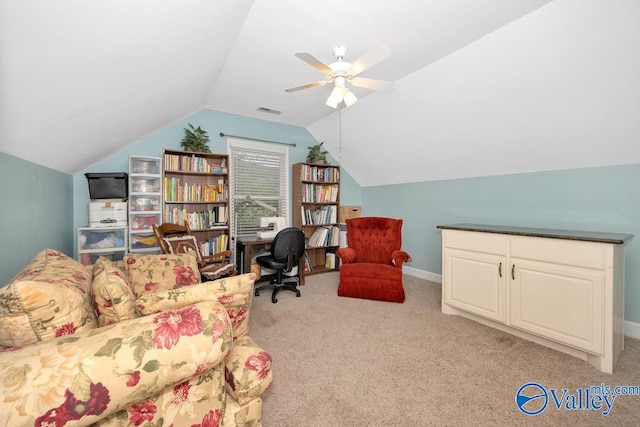 interior space with ceiling fan, lofted ceiling, and light carpet