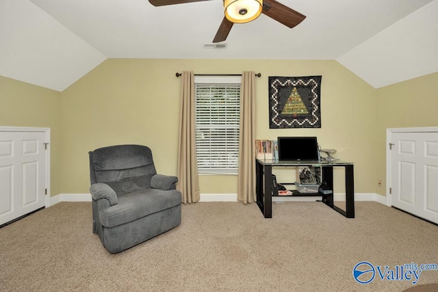 living area with lofted ceiling, light carpet, and ceiling fan