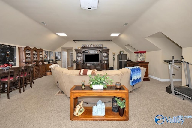 living room featuring vaulted ceiling and light colored carpet