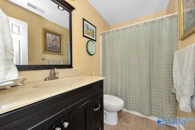 bathroom featuring vanity, tile patterned flooring, toilet, and curtained shower