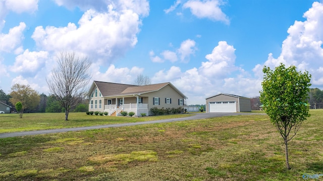 single story home featuring an outdoor structure, aphalt driveway, a front lawn, a porch, and a garage