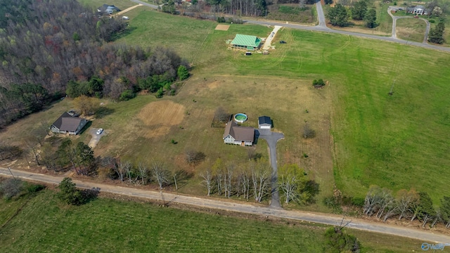 birds eye view of property with a rural view