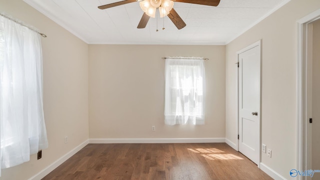 701 10th St NW, Huntsville, AL 35805 - unfurnished bedroom featuring baseboards, ornamental molding, and wood finished floors
