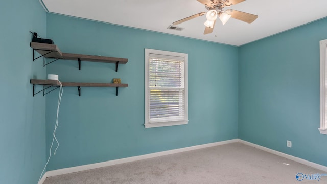 701 10th St NW, Huntsville, AL 35805 - empty room with baseboards, a ceiling fan, carpet flooring, and visible vents