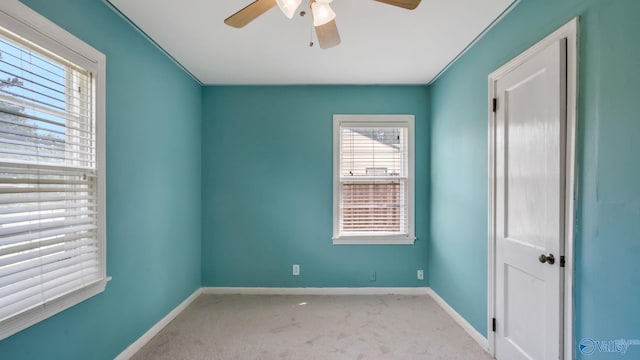 701 10th St NW, Huntsville, AL 35805 - empty room with carpet floors, ceiling fan, and baseboards