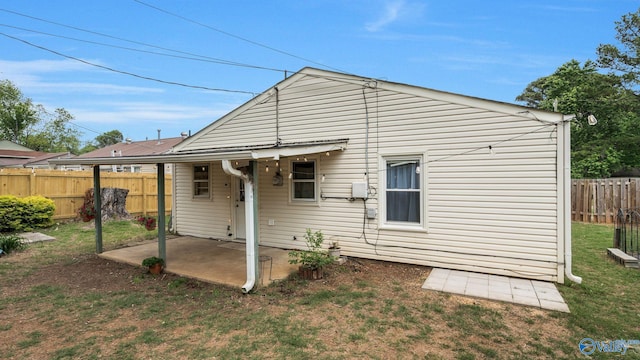 701 10th St NW, Huntsville, AL 35805 - rear view of property with a patio, a fenced backyard, and a yard