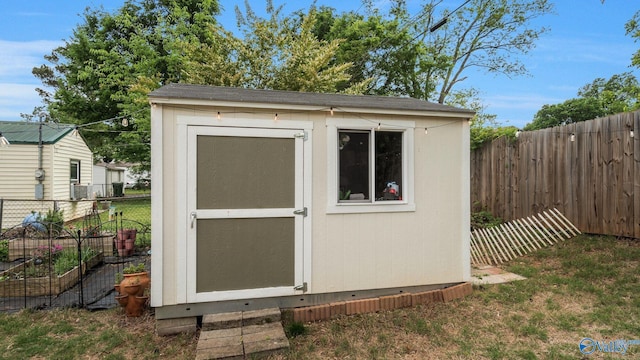 701 10th St NW, Huntsville, AL 35805 - view of shed with a fenced backyard and a vegetable garden