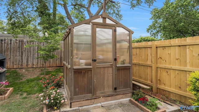 701 10th St NW, Huntsville, AL 35805 - view of greenhouse featuring a fenced backyard