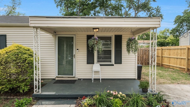 701 10th St NW, Huntsville, AL 35805 - property entrance featuring a porch and fence
