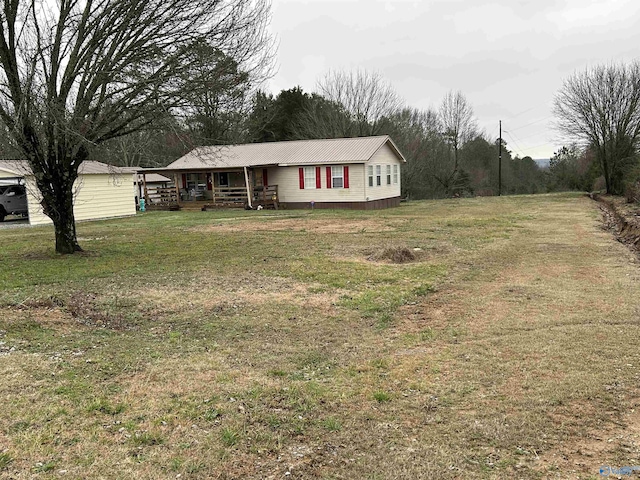 view of front of property with a front yard and covered porch