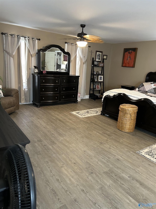 bedroom featuring wood-type flooring and ceiling fan