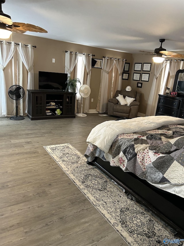 bedroom featuring ceiling fan and hardwood / wood-style floors