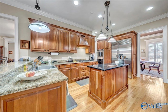 kitchen with ornamental molding, light stone counters, stainless steel appliances, brown cabinetry, and custom exhaust hood