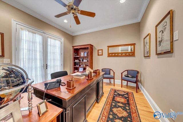 office space featuring ceiling fan, baseboards, light wood-style floors, and ornamental molding