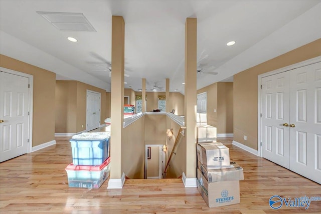 interior space with recessed lighting, wood finished floors, and baseboards