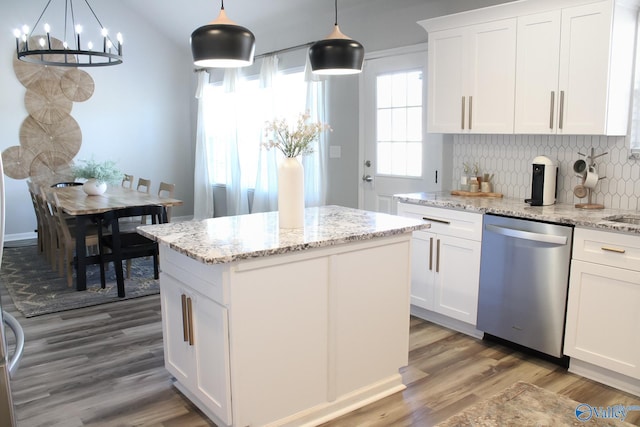 kitchen featuring white cabinetry, tasteful backsplash, dishwasher, and pendant lighting