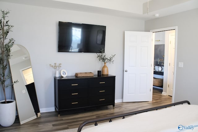 bedroom featuring dark hardwood / wood-style flooring