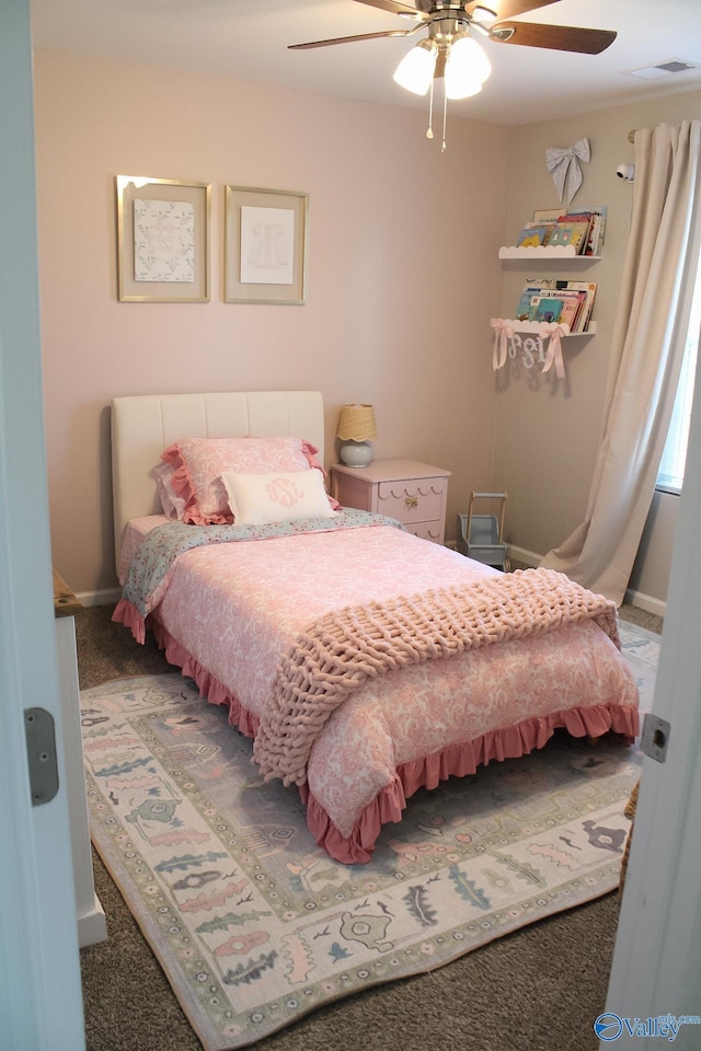 bedroom featuring ceiling fan and carpet