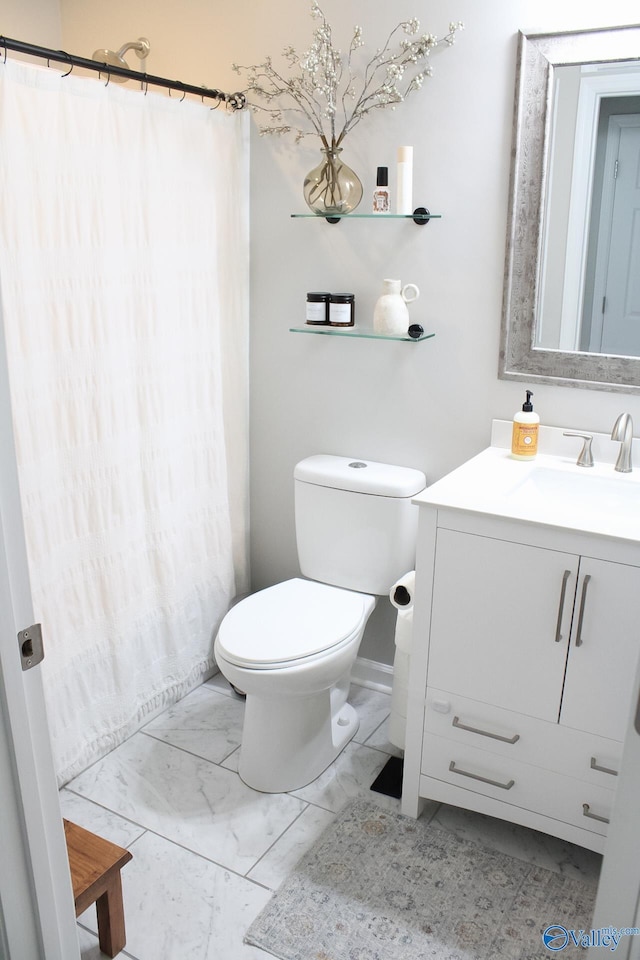 bathroom with vanity and toilet