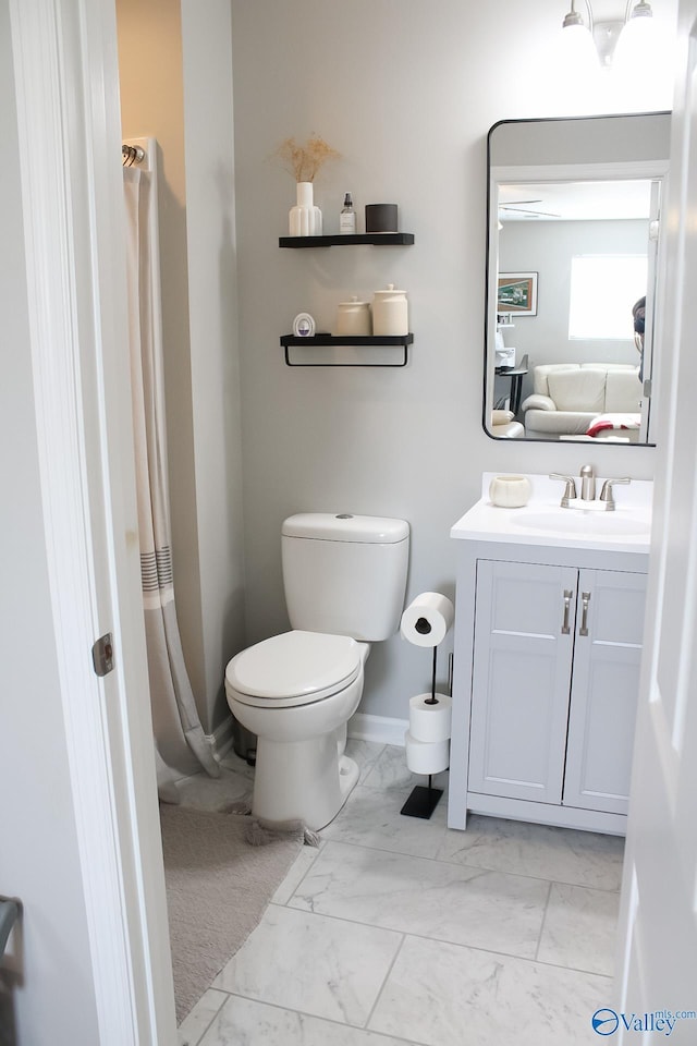 bathroom with toilet and vanity