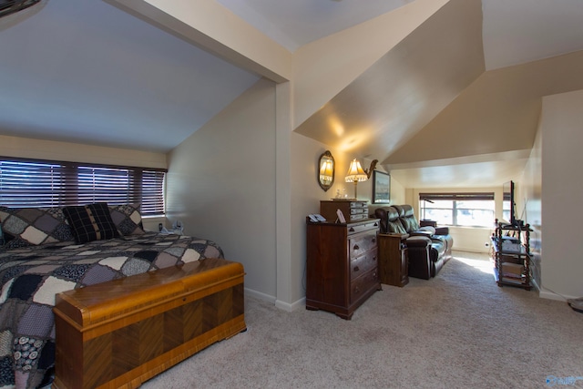 bedroom featuring light carpet and lofted ceiling